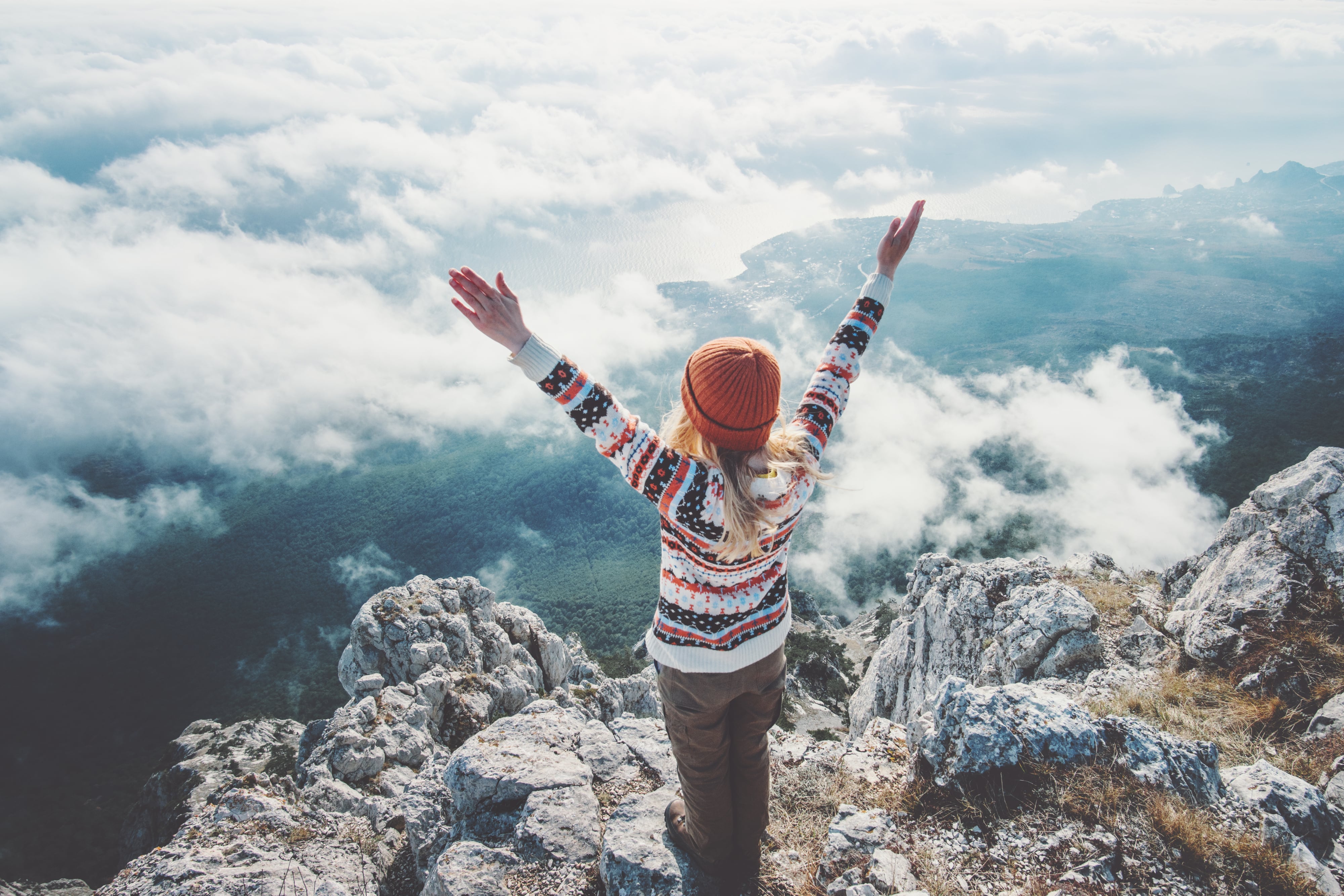 Happy Woman Traveler On Mountain Summit Hands raised