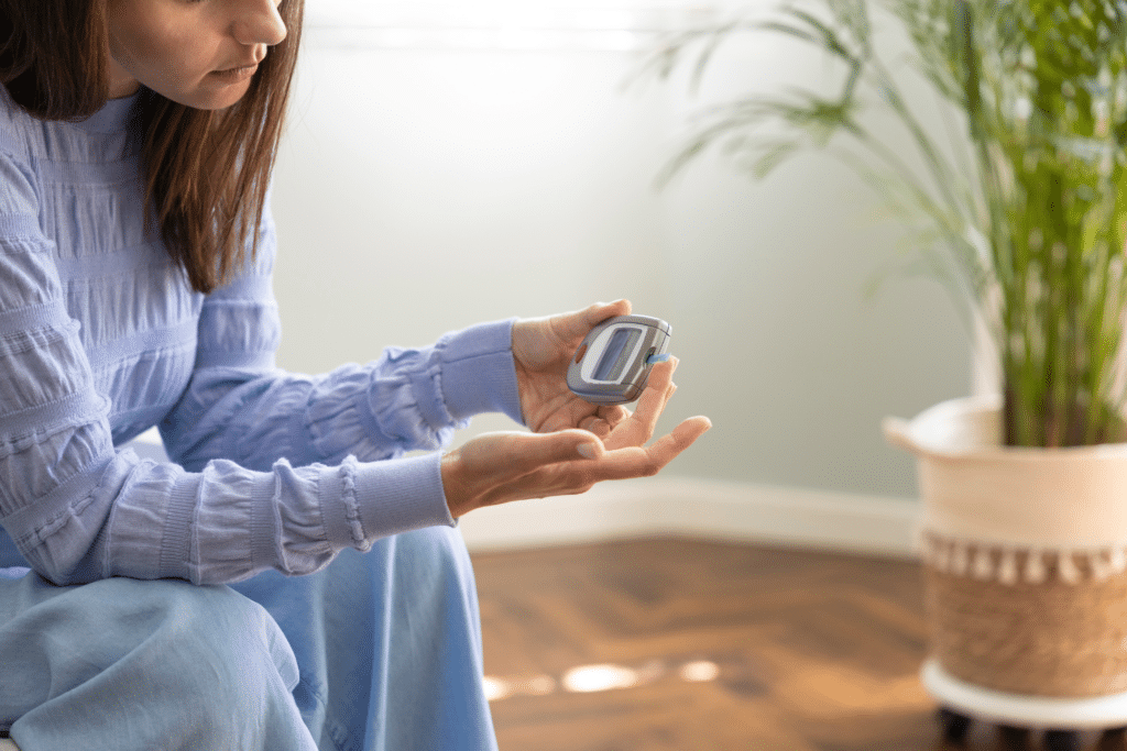 woman checking her blood sugar